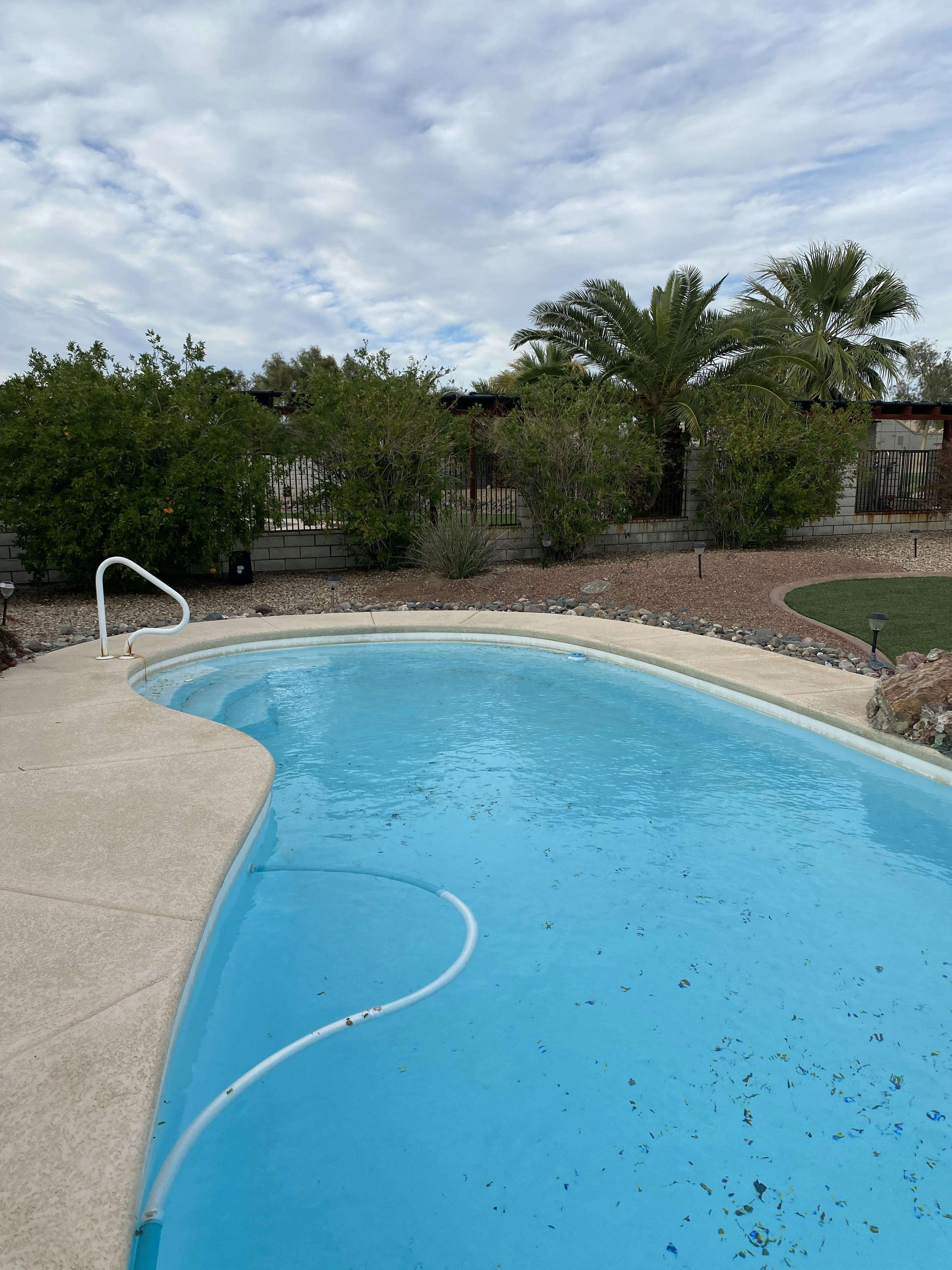 Refreshing Pool With Covered Patio Outdoor Patio Furniture And Umbrella ...